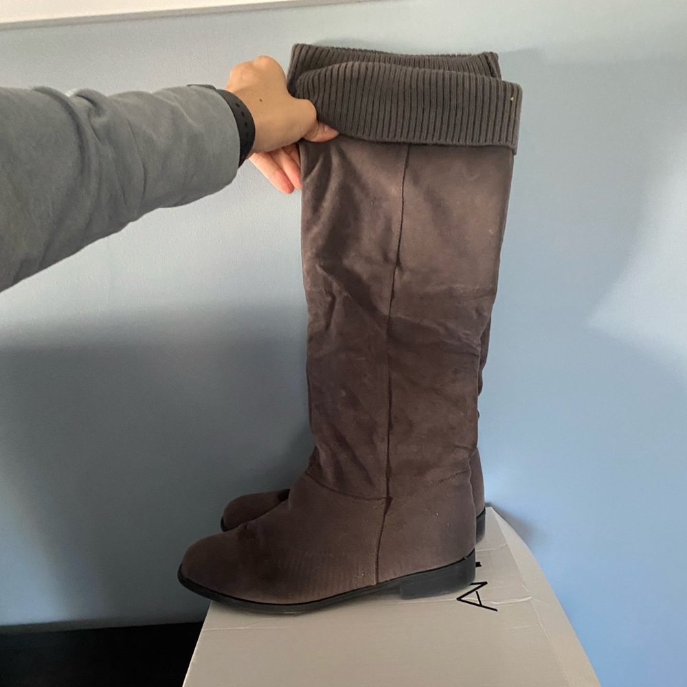 Grey suede, fabric cuff at top, zipper on side, hits just below knee